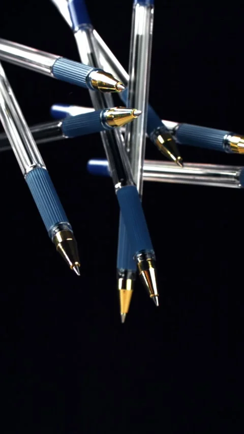 School pens fly up and down. Filmed on a high-speed camera at 1000 fps Stock Footage 335375559
