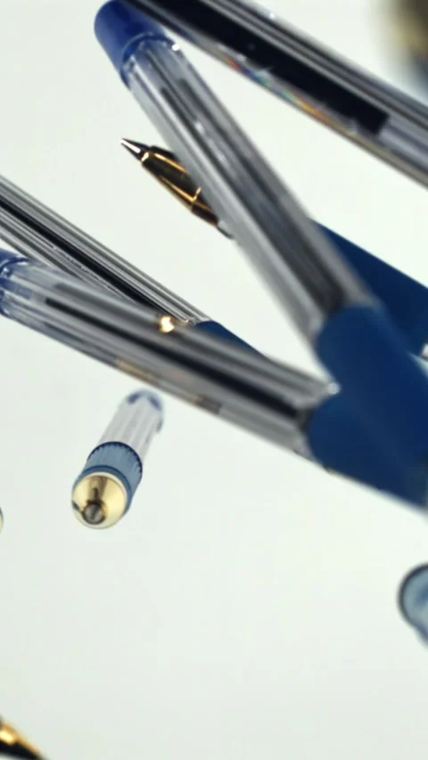 School pens fly up and down. Filmed on a high-speed camera at 1000 fps Stock Footage 335379522
