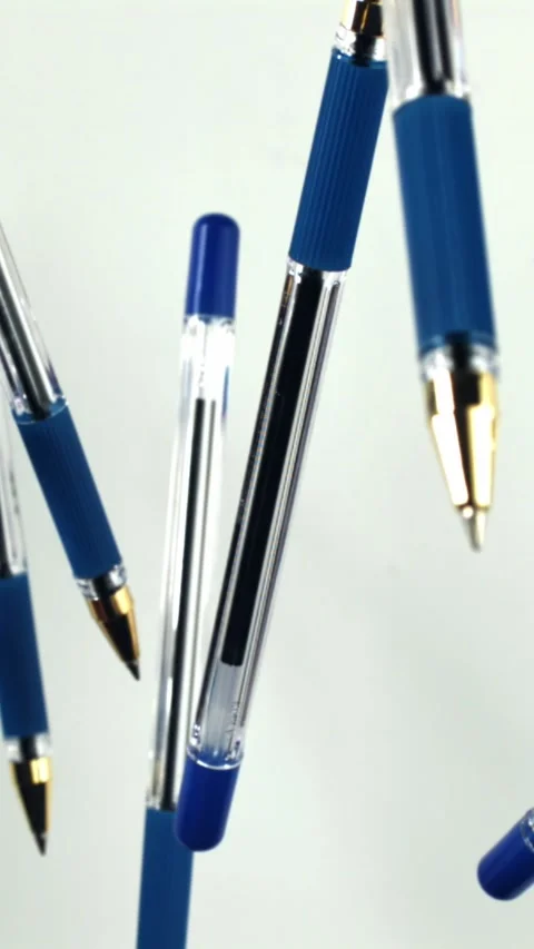 School pens fly up and down. Filmed on a high-speed camera at 1000 fps Stock Footage 335381679