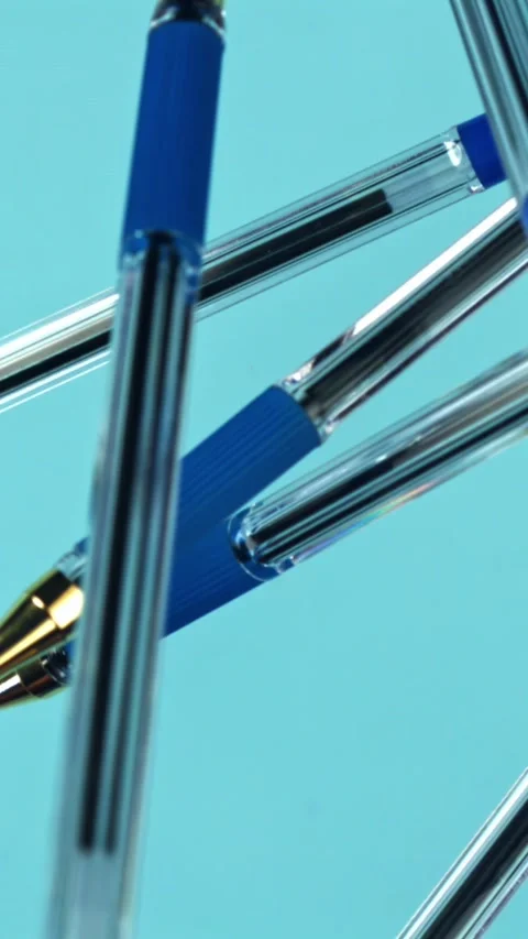 School pens fly up and down. Filmed on a high-speed camera at 1000 fps Stock Footage 335384541