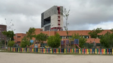 School playground with modern high-rise building in background Stock Footage 336733763
