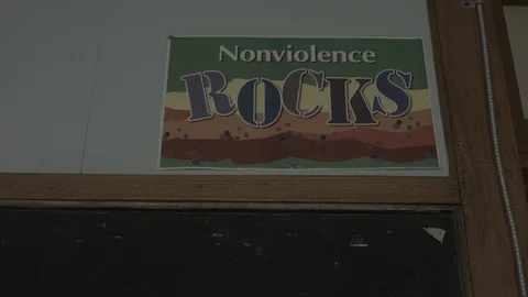 School poster hung up, Nonviolence Rocks sign  Stock Footage 90398198