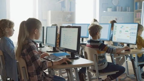 School Science Classroom: Teacher Educates Smart Schoolchildren who Work on PC Stock Footage 119359453