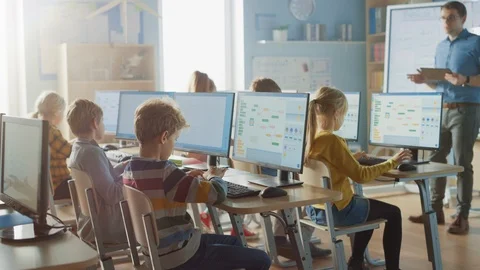 School Science Classroom: Teacher Educates Smart Schoolchildren who Work on PC Stock Footage 119359473