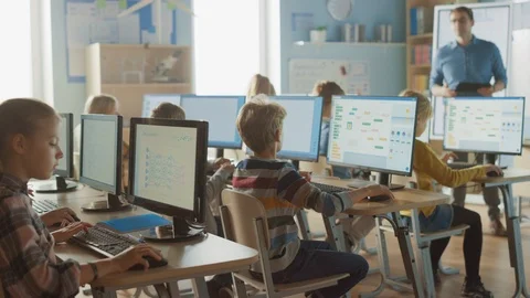 School Science Classroom: Teacher Educates Smart Schoolchildren who Work on PC Stock Footage 119359498