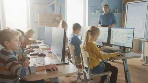 School Science Classroom: Teacher Educates Smart Schoolchildren who Work on PC Stock Footage 119359604