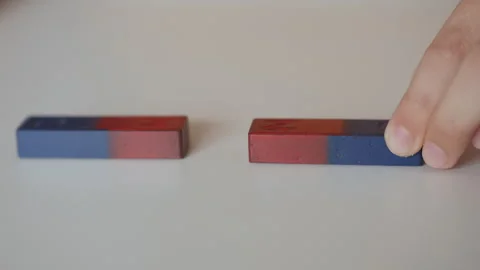 School Science Educational Experiment With Magnets. Child Hands Moves Two Stock Footage 278316938
