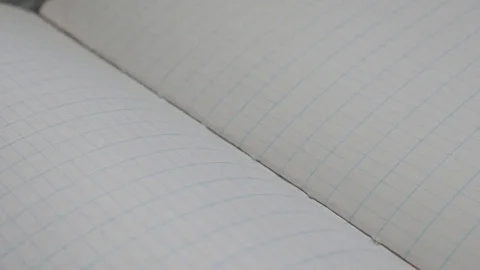 School scrap book white surface slow pan Video stock 75737315