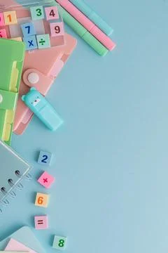 School stationery composition with math numbers on blue background Stock Photos