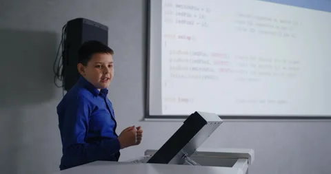 School Student Boy Speaking In Front Of Classmates In Classroom, Presenting His Stock Footage 280172781