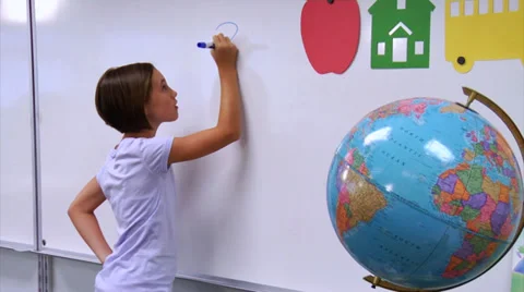 School student doing a math problem on white board Stock Footage 32708408