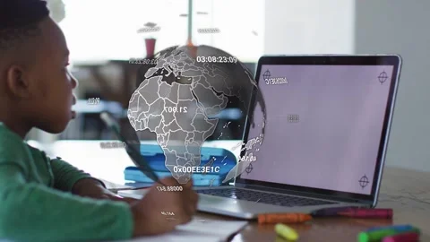 School student writing for homework while laptop crosshairs causing rotating Stock Footage 334728877