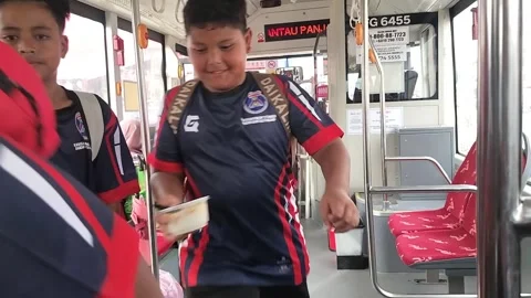 School Students Boarding Public Bus in Kota Bharu Stock Footage 326175863