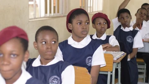 School students learning ,writing and listening to teacher in the classroom Stock-Footage 250831483