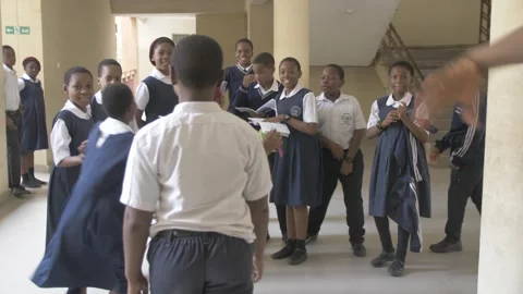 School students learning ,writing and listening to teacher in the classroom Stock Footage 251654229