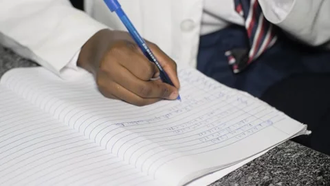 School students learning ,writing and listening to teacher in the classroom 库存影片 252326246