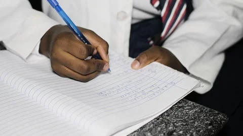 School students learning ,writing and listening to teacher in the classroom Stockbeeldmateriaal 252326694