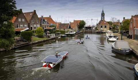 School students sail the Elfstedentocht with solar boats, Hindeloopen, Netherlan Stock Photos
