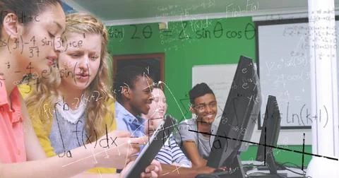 In school, students using computers collaborating on math project, staying 库存插图