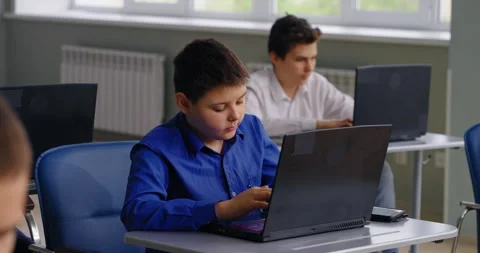 School Students Working With Laptops In Modern Computer-Based Classroom Stock Footage 280174577