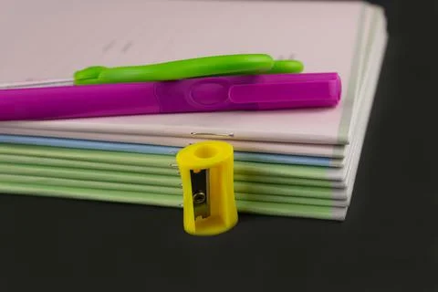 School supplies and a stack of study books Stock Photos