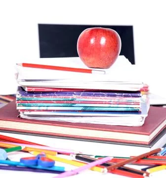 School supplies with an apple Stock Photos