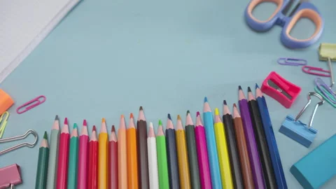 School Supplies Arranged Around an Open Squared Notebook with Large Copy Space Stock Footage 337882669
