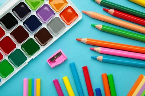 School supplies on blue background. Back to school concept. Stock Photos