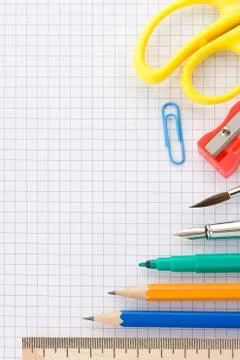 School supplies on checked background Stock Photos