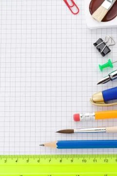 School supplies on checked background Stock Photos