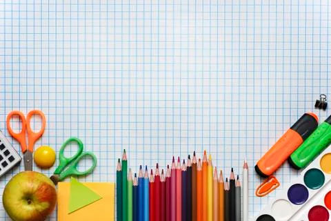 School supplies on checkered leaf background. Back to school concept Stock Photos