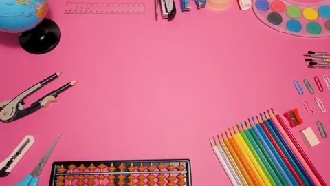 School supplies on pink board background, Stock Video