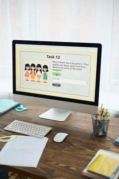 School Task on Computer Screen on Desk at Home Stock Photos