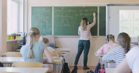 School Teacher Writing Math Formula on the Board Stock Footage 97339814