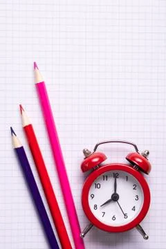 School time minimalistic concept. Colored pencils and notebooks Stock Photos