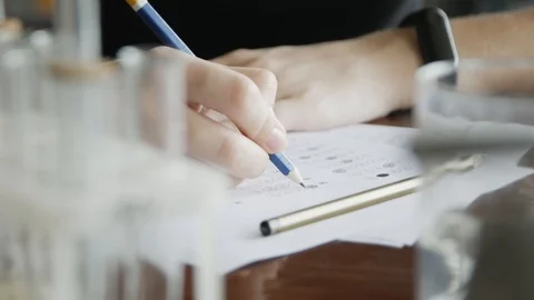 School / university Students hands taking exams, writing examination room wit Vidéo 113347782