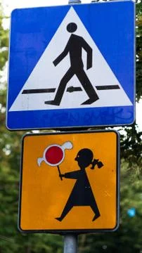 School Warning Sign with the trees background. Crosswalk sign with a girl 스톡 사진