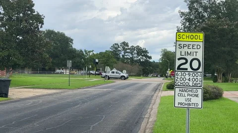 School Zone rolling stop Stock Footage 229656454
