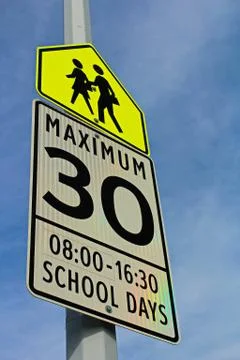 School Zone Sign with a Maximum Speed and Effective Hours Stock Photos