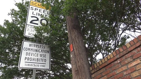 School zone speed limit and electronic devices prohibited signs Video stock 75553114
