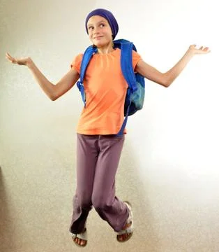 Schoolboy with backpack jumping and running Stock Photos