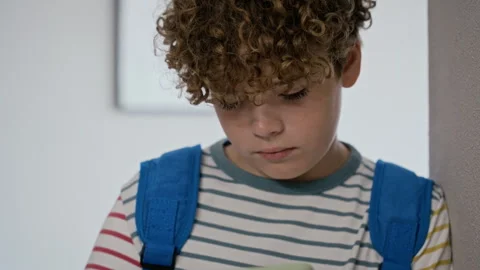 Schoolboy with Backpack Using Smartphone in Art Gallery Stock Footage 343614026