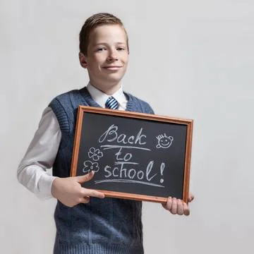 Schoolboy with chalkboard - back to school Stock Photos