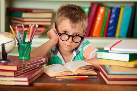 Schoolboy in classroom. Stock Photos