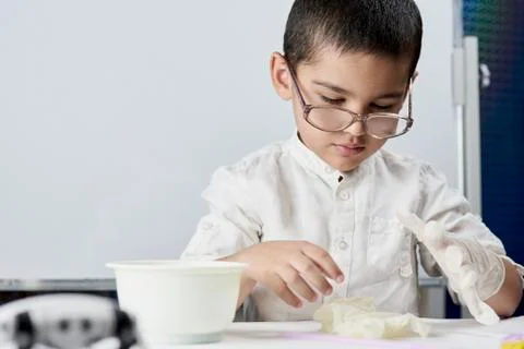 Schoolboy conducting scientific experiments Stock Photos