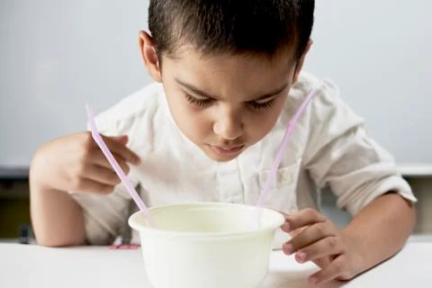 Schoolboy conducting scientific experiments Stock Photos
