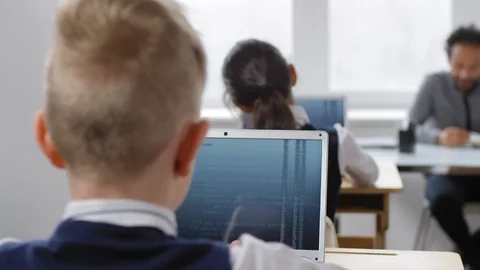 Schoolboy Developing Computer Algorithm on Laptop in Class Stock Footage 112339716