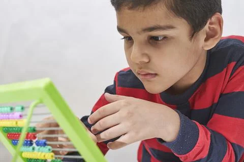 A schoolboy do mental math Stock Photos