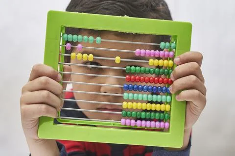 A schoolboy do mental math Stock Photos