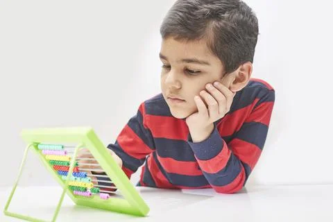 A schoolboy do mental math Stock Photos